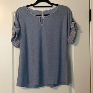 Light blue shirt with stripe accents